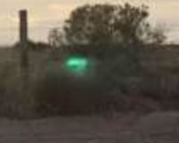 green alien head or orb next to skinwalker